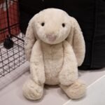 Cream bashful-style long-ear bunny stuffed animal with fluffy plush fur and floppy ears, full body view, perfect cuddly toy gift UK