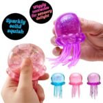 Hand squeezing pink jellyfish squishy toy showing wiggly tentacles