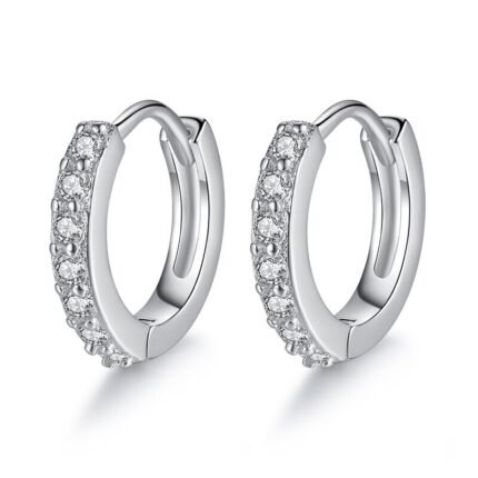 Detailed view of round zircon-studded silver hoop earrings